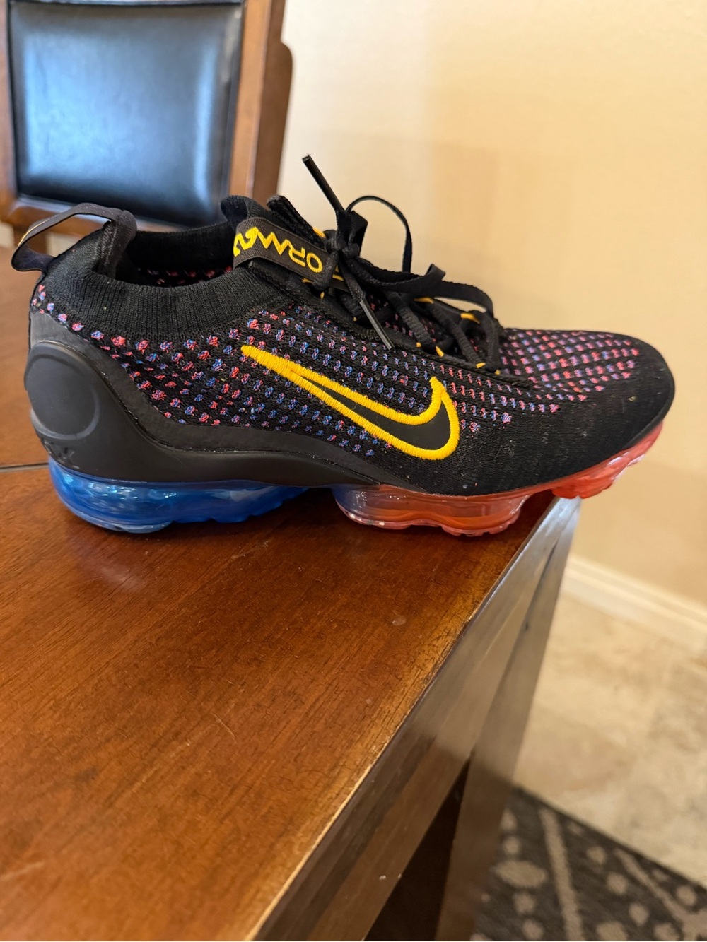 Nike AIR VAPORMAX Black Flyknit Sneaker with Orange Swoosh and Multi-Color Knit